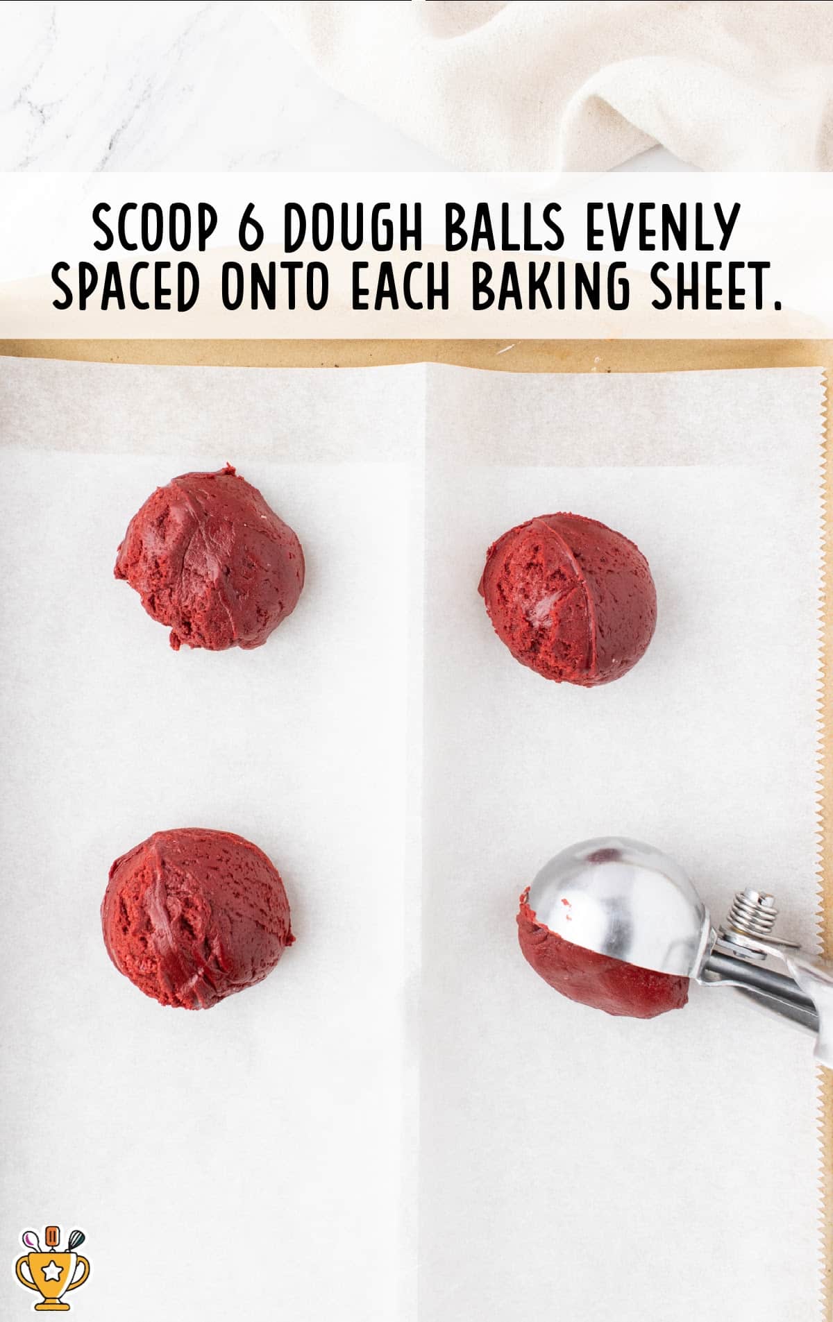 scooping dough balls on a baking sheet