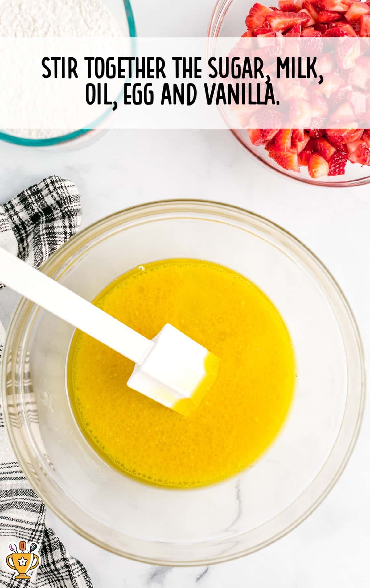 sugar, milk, oil, egg and vanilla mixed together in a clear bowl