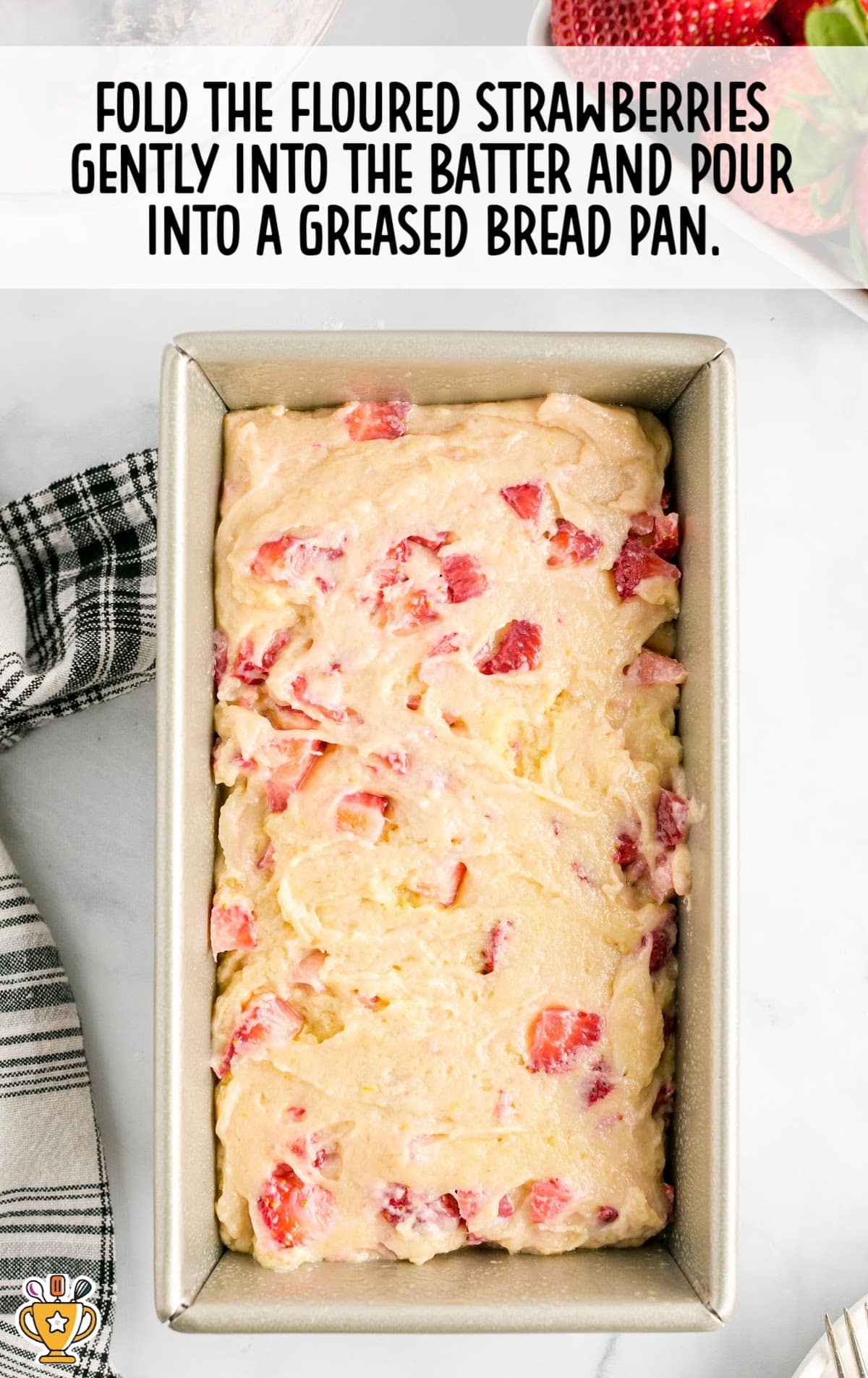 strawberries folded into the batter and poured into a greased bread pan