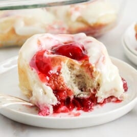 a piece of Strawberry Cinnamon Rolls on a plate