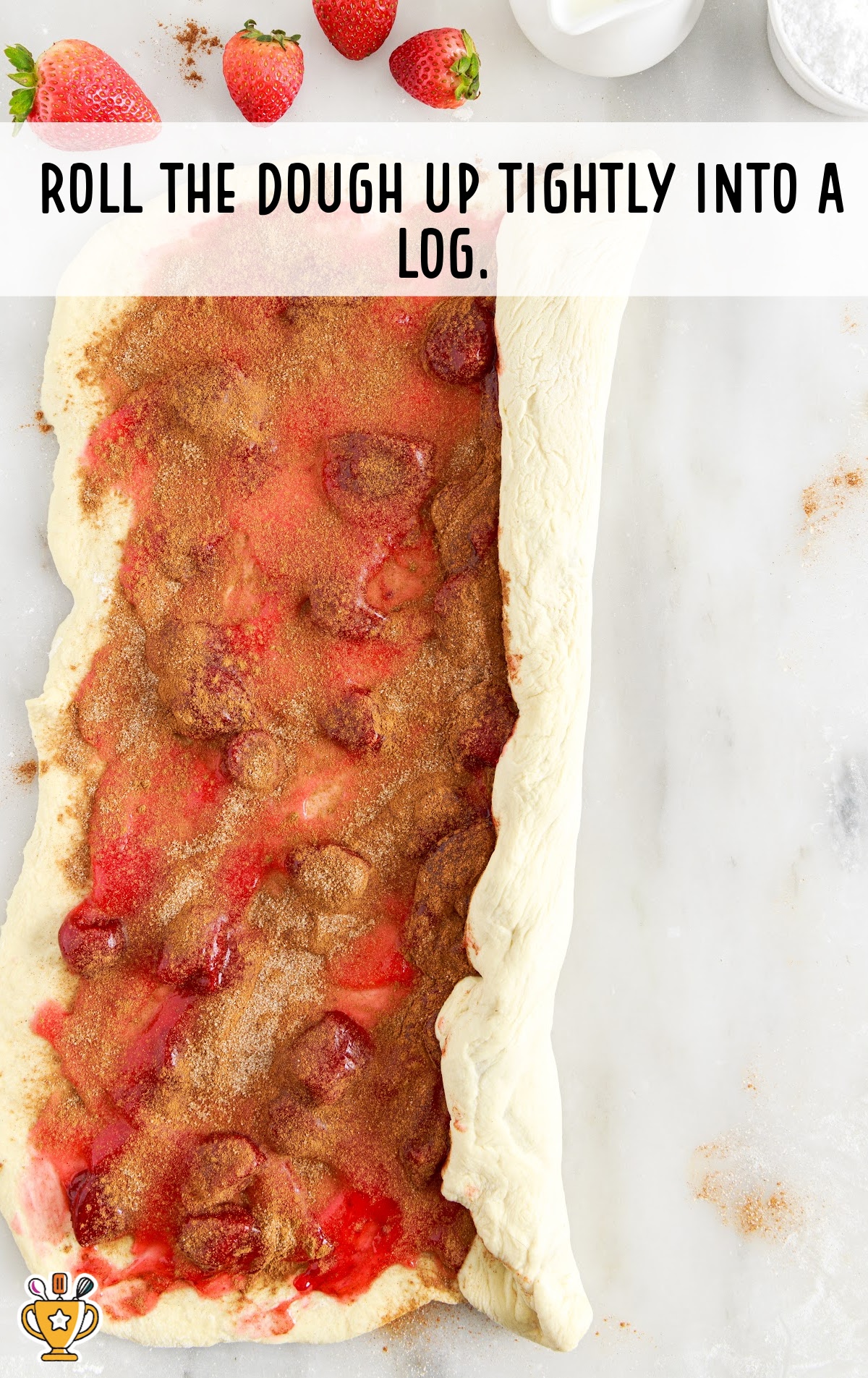 rolling the dough up tightly into a log