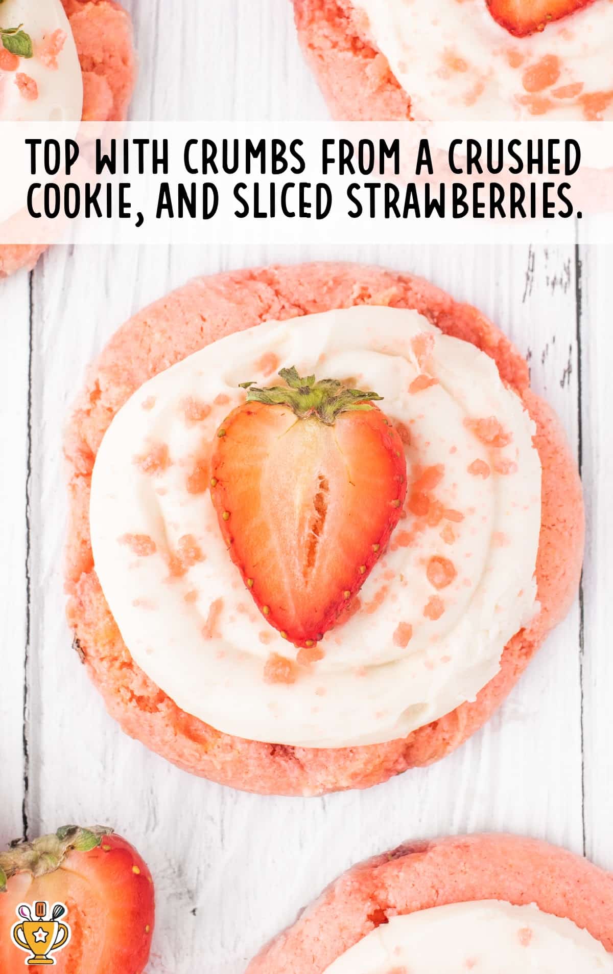 Strawberry Cookies with Cream Cheese Frosting with a sliced strawberry on top