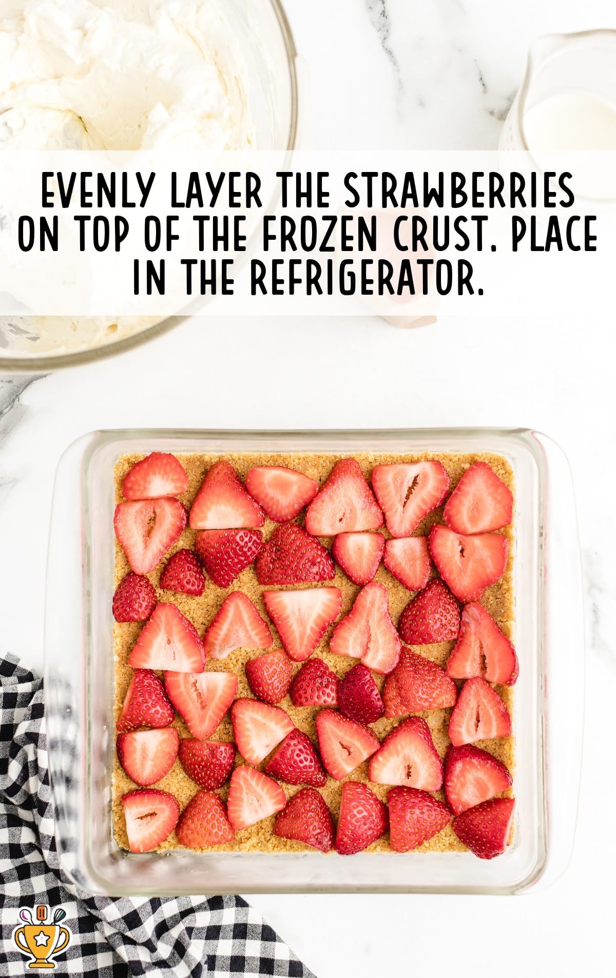 layer of strawberries on top of frozen crust
