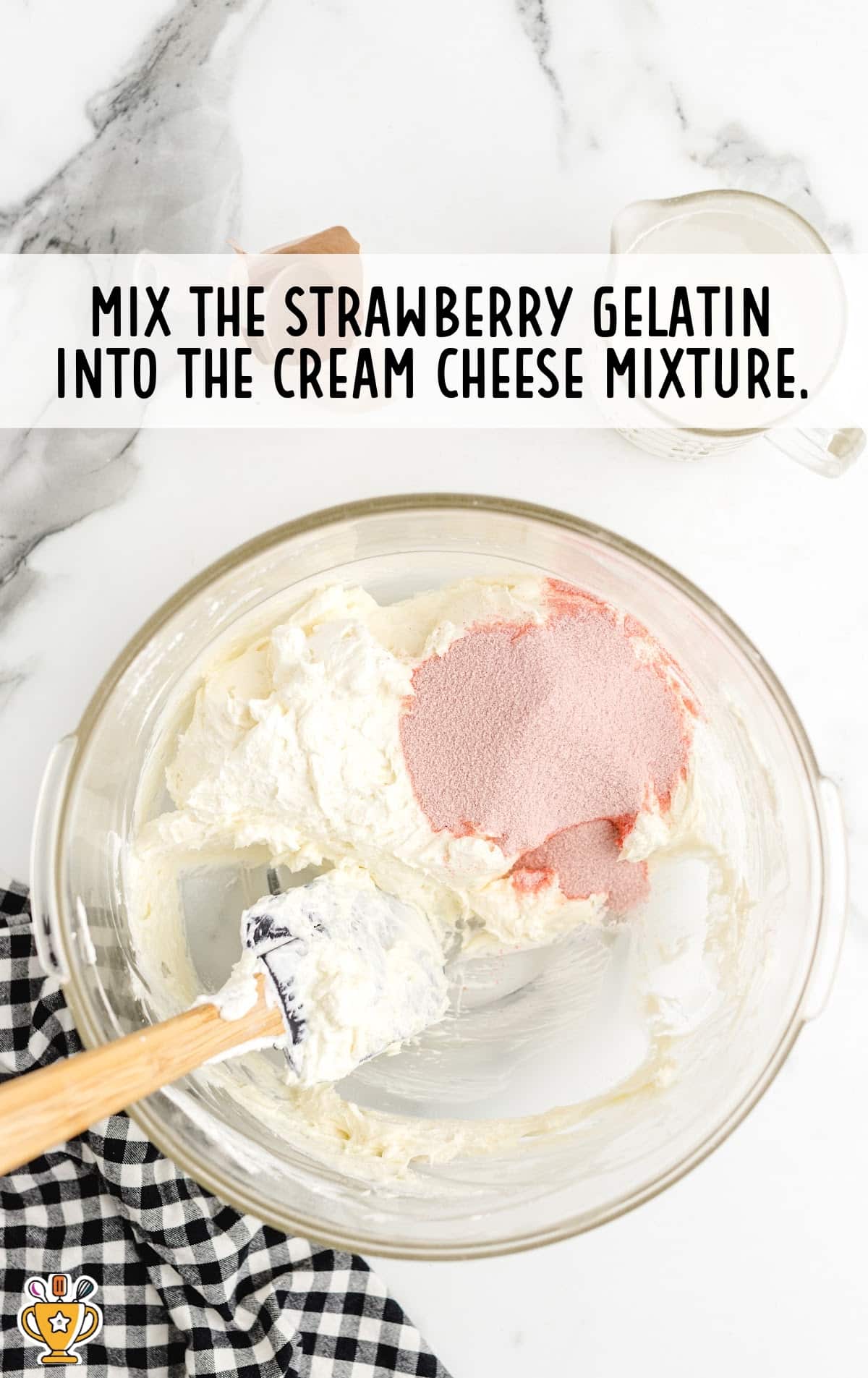 mixing strawberry gelatin into the cream cheese mixture