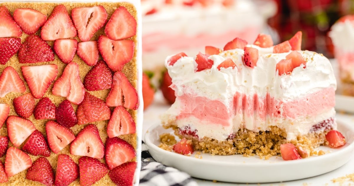 a piece of Strawberry Delight on a plate and in a baking dish