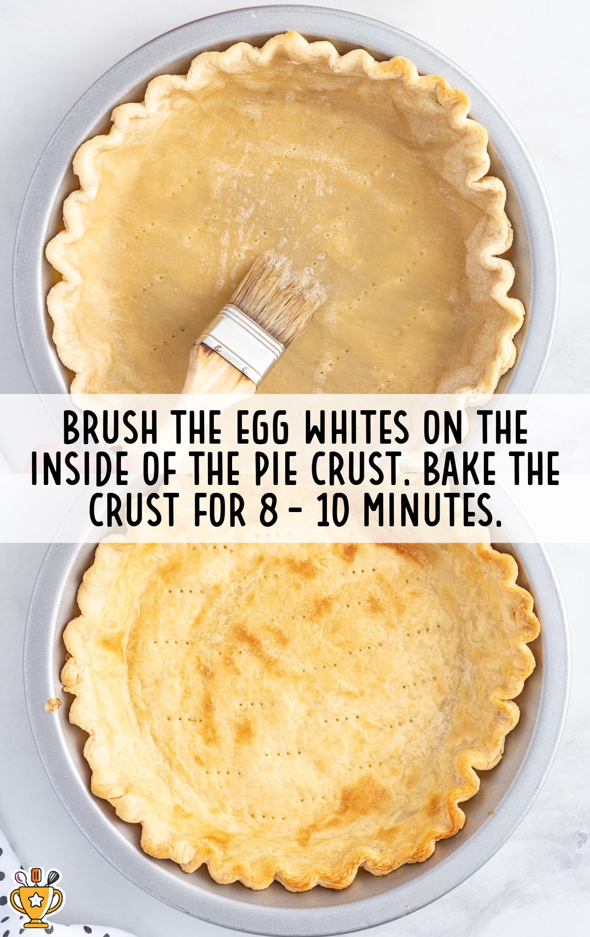 brushing egg whites on the inside of the pie crust