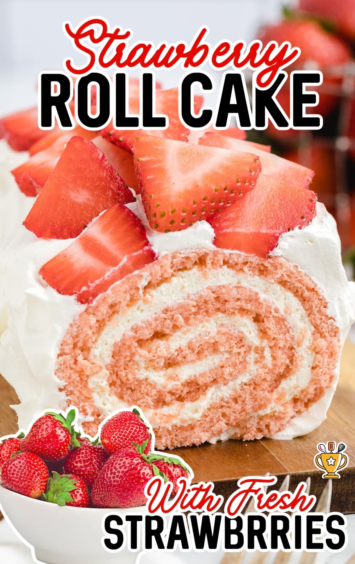 a Strawberry Roll Cake with a bowl full of strawberries