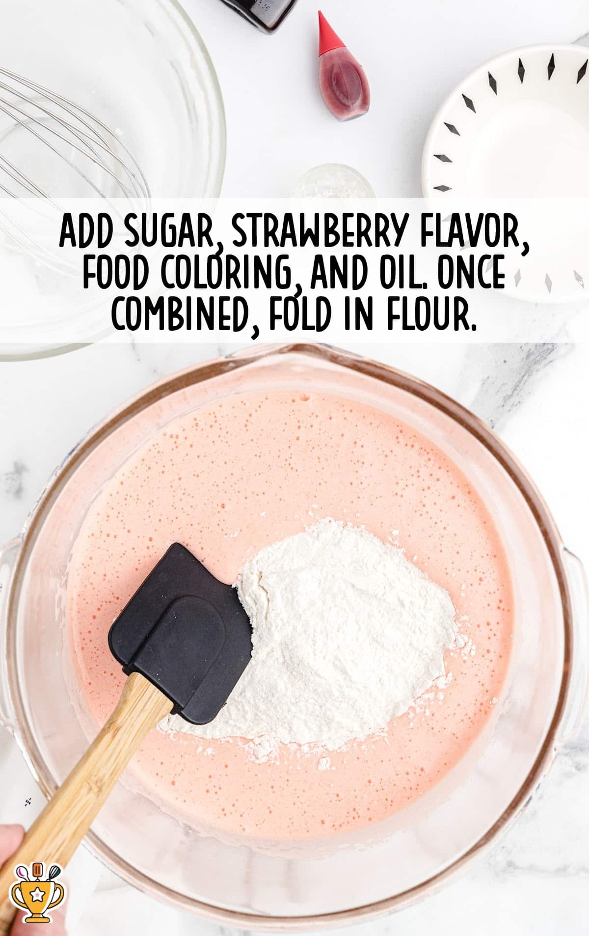 sugar, strawberry flavor, food coloring and oil mixed in a bowl