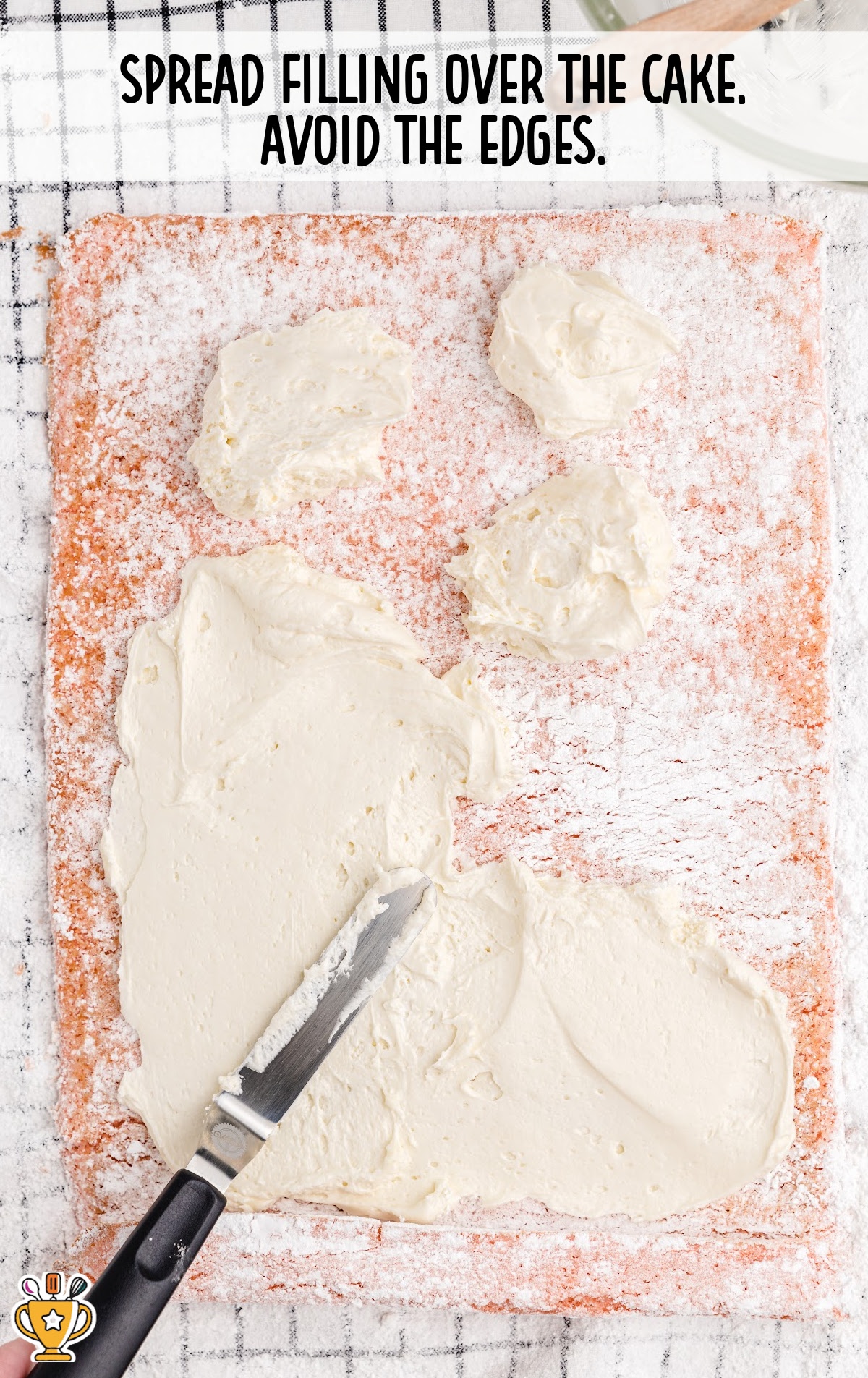 spreading the filling over the cake
