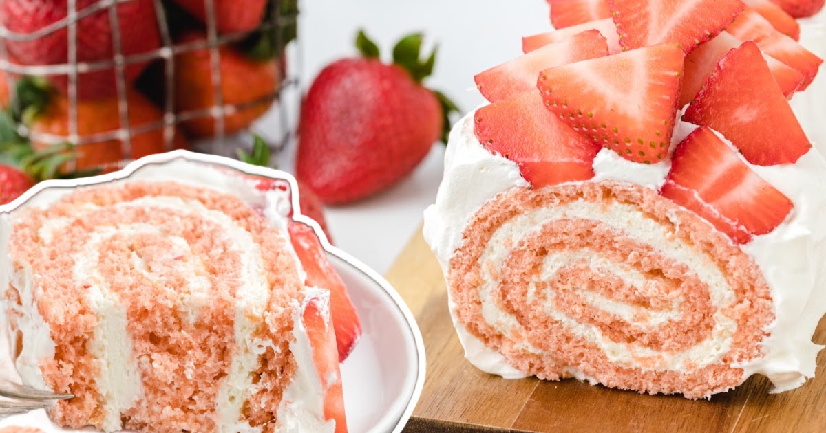 Strawberry Roll Cake on a wooden board and on a plate