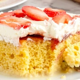 a piece of Strawberry Tres Leches Cake on a plate