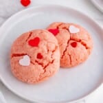 Two Valentine Cookies on a white plate.