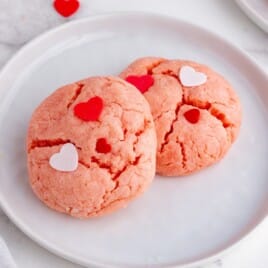 Two Valentine Cookies on a white plate.