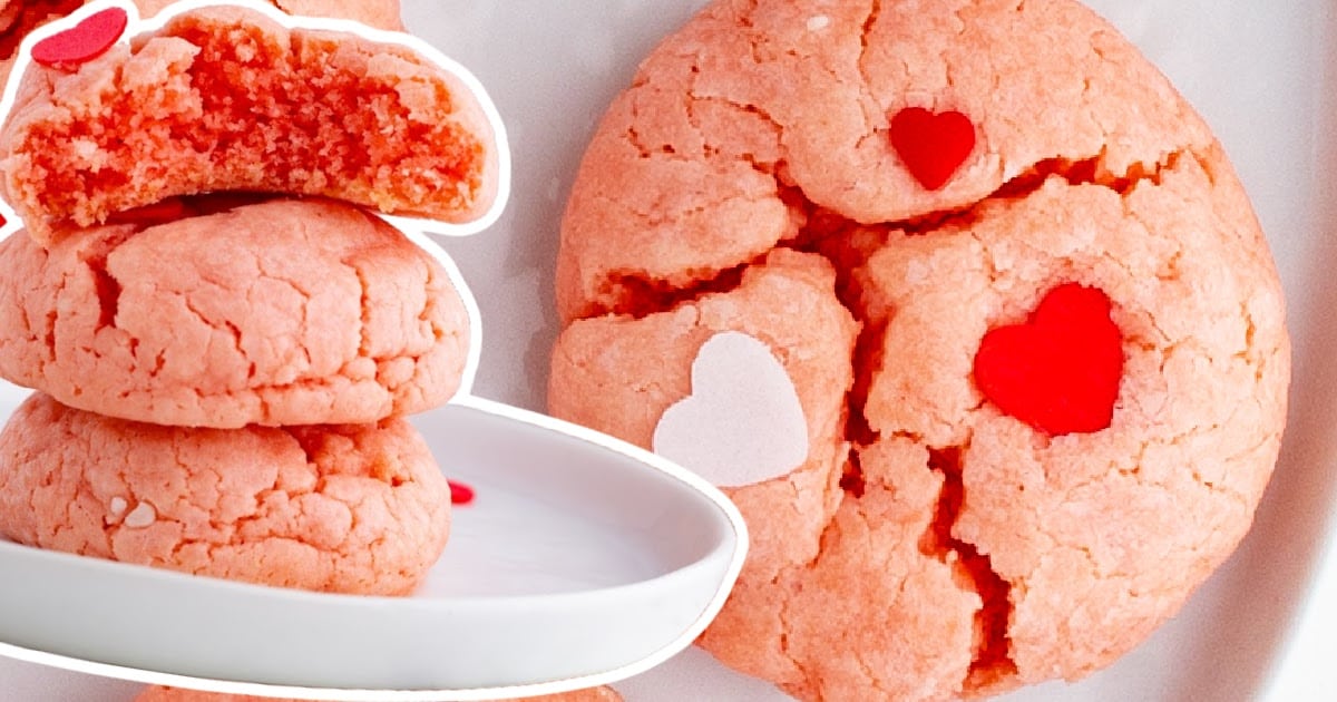A plate of cookies and one has a bite out of it.
