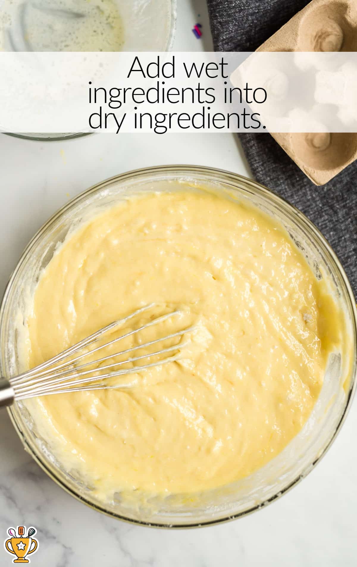 Vanilla Cupcakes batter in a bowl with a whisker