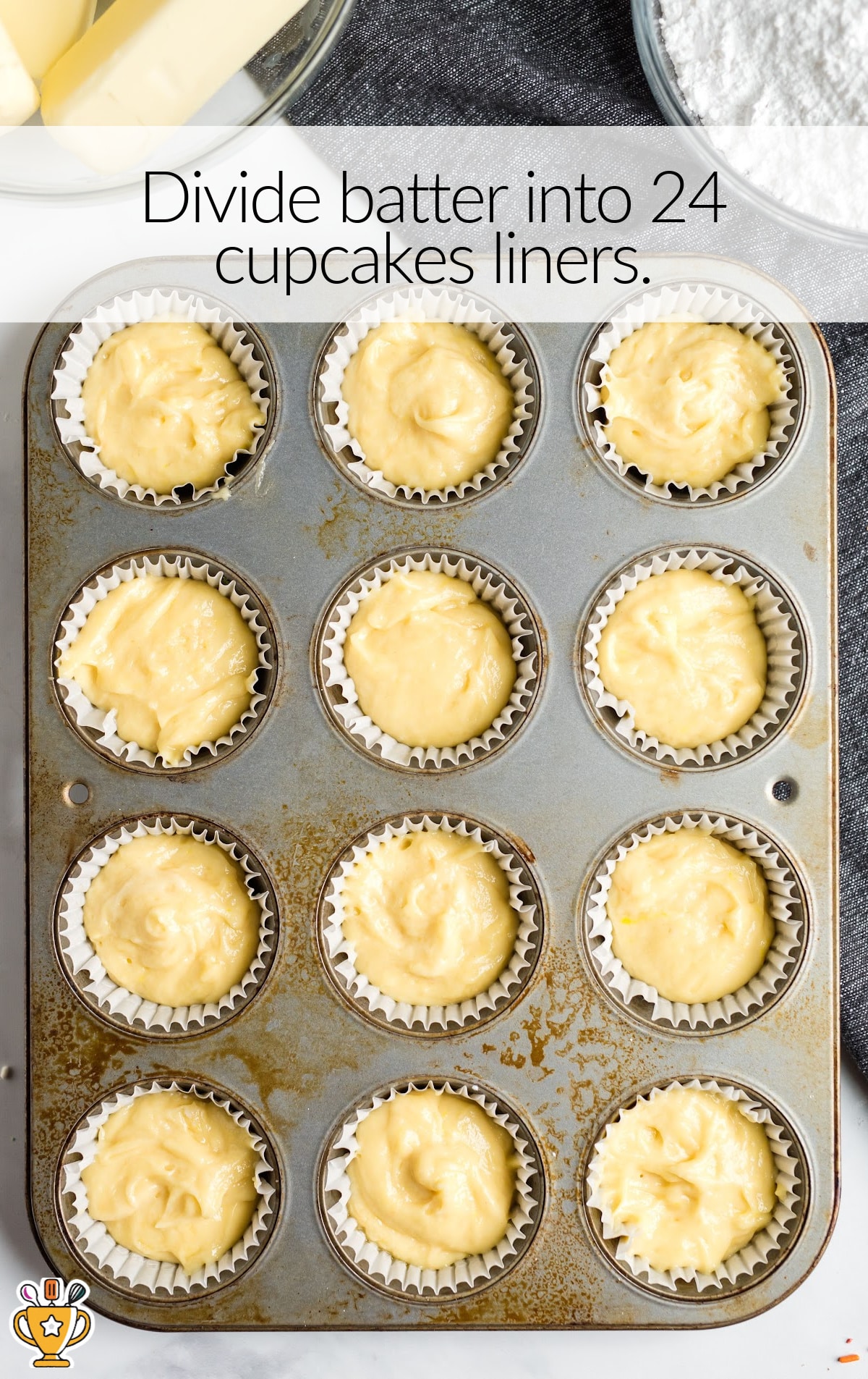 batter in cupcake liners in a baking pan