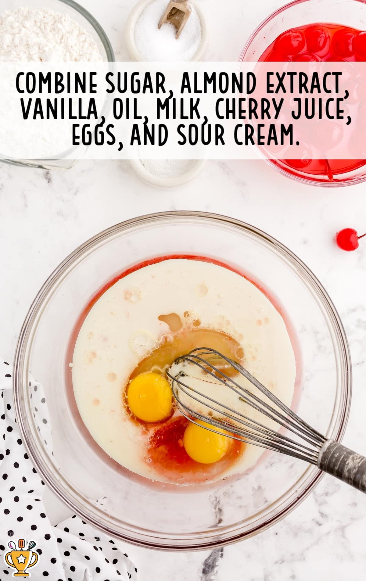 sugar, almond extract, vanilla, oil, milk, cherry juice, eggs and sour cream mixed in a bowl