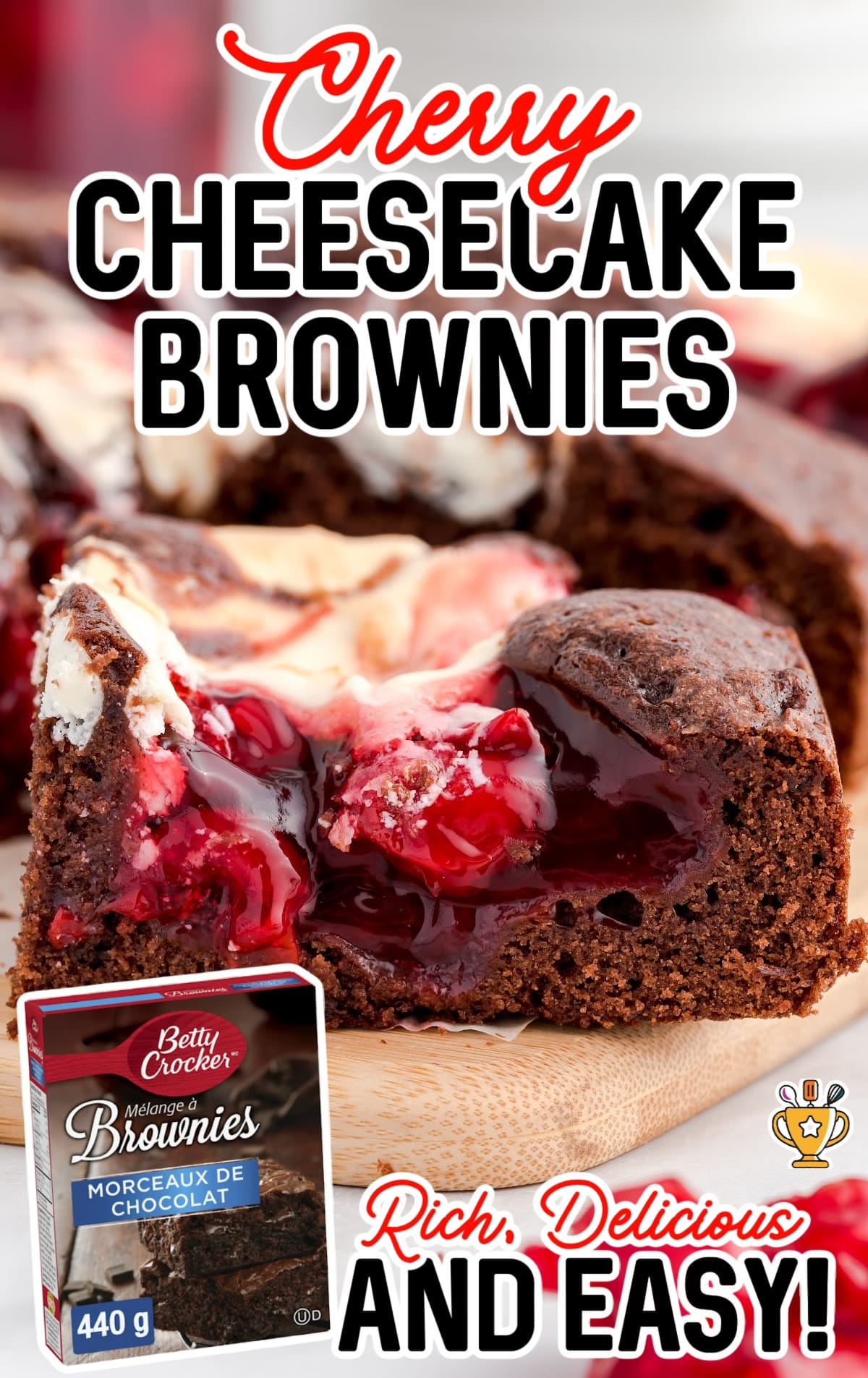 a Cherry Cheesecake Brownie on a curtting board and a box of brownie mix.