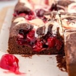 Cherry Cheesecake Brownies sliced so all the cherries are showing.
