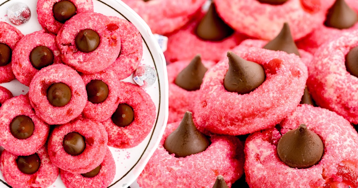 Cherry Kiss Cookies on a plate and a bunch others on the side
