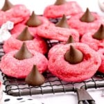 a bunch of Cherry Kiss Cookies on a cooling rack