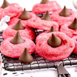 a bunch of Cherry Kiss Cookies on a cooling rack