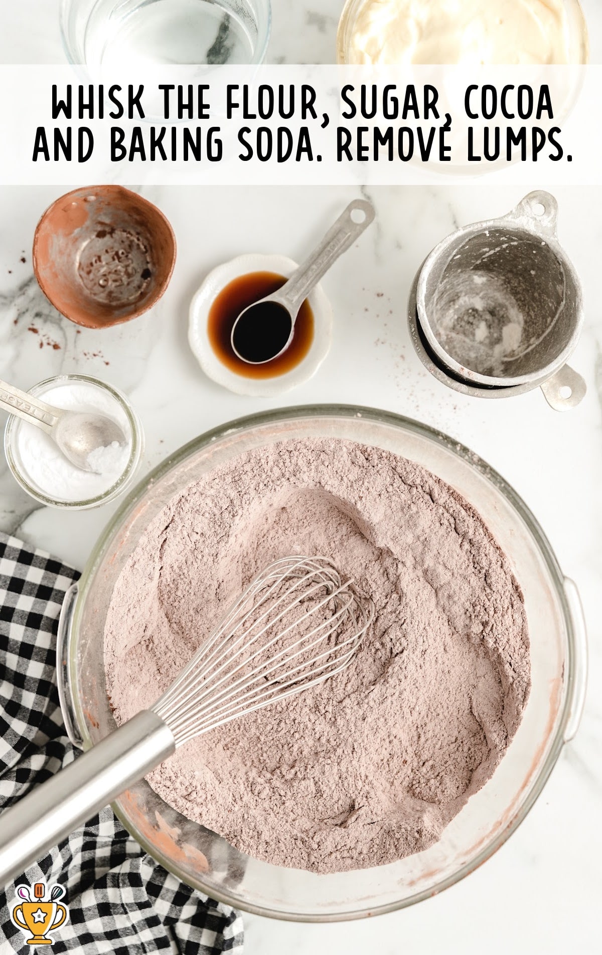 flour, sugar, cocoa and baking soda mixed in a bowl