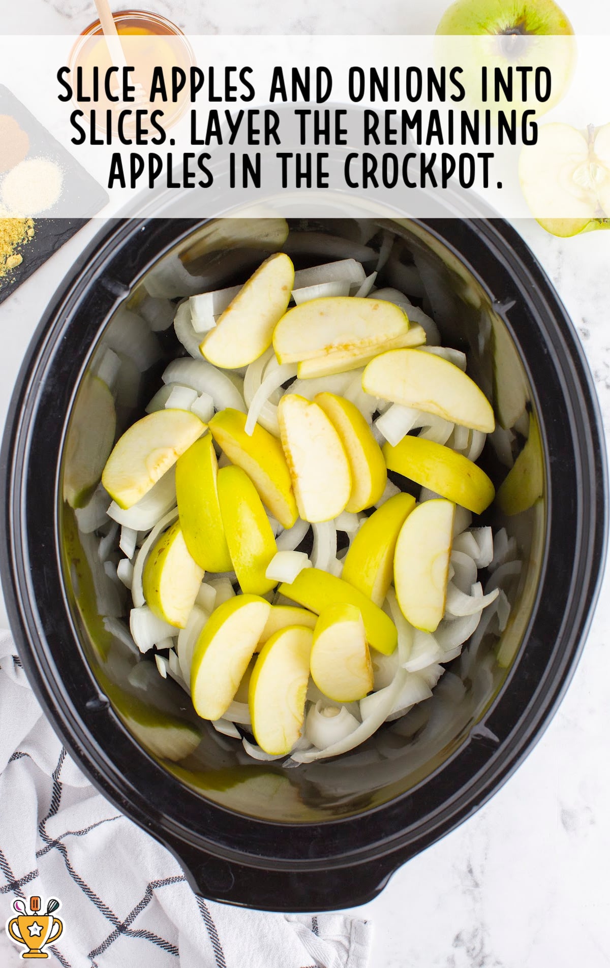 slices of apples and onions in a crockpot