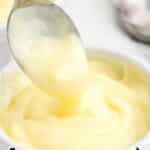 Custard in a bowl with a spoon