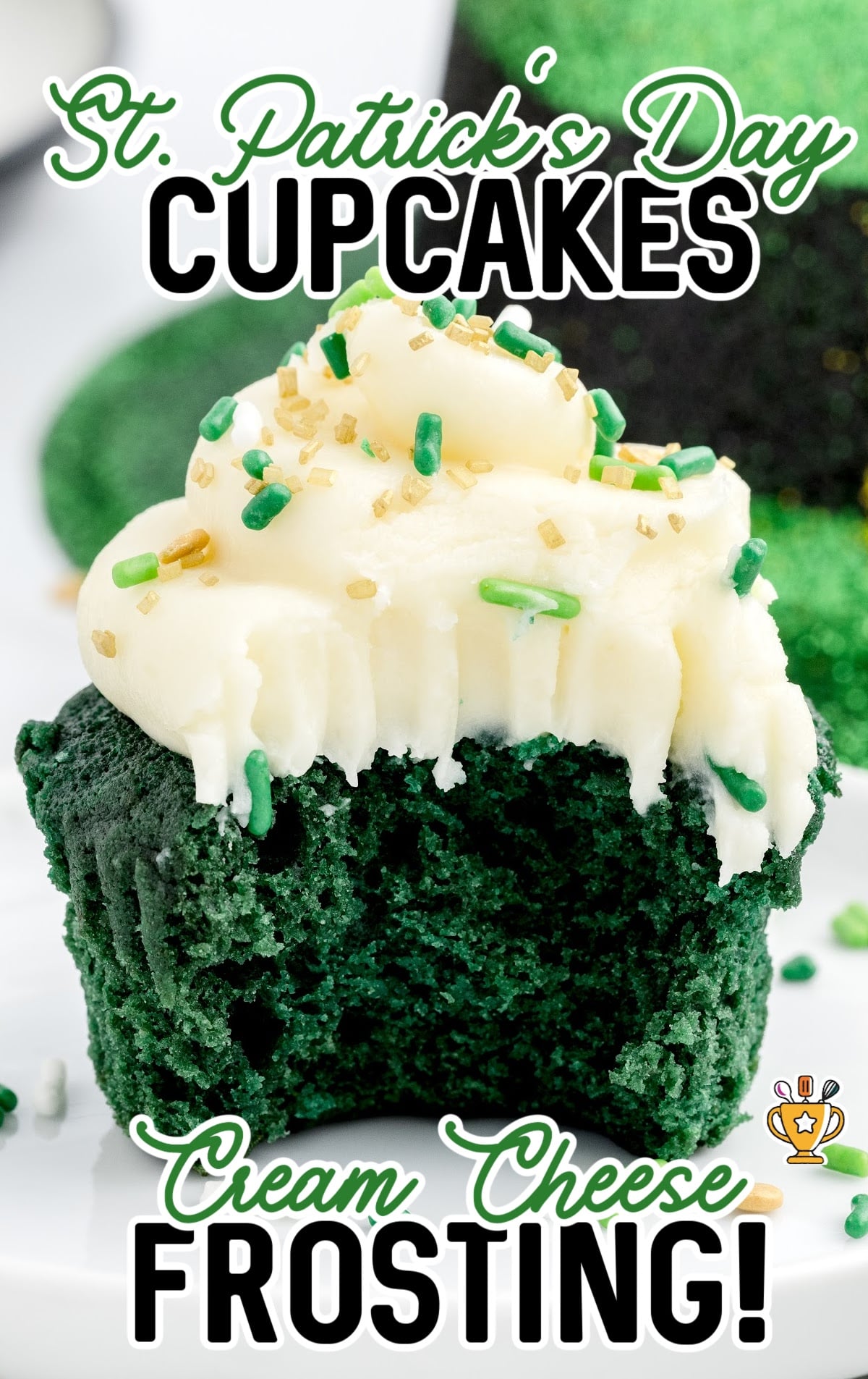 a Green Cupcake on a plate with a bite on it