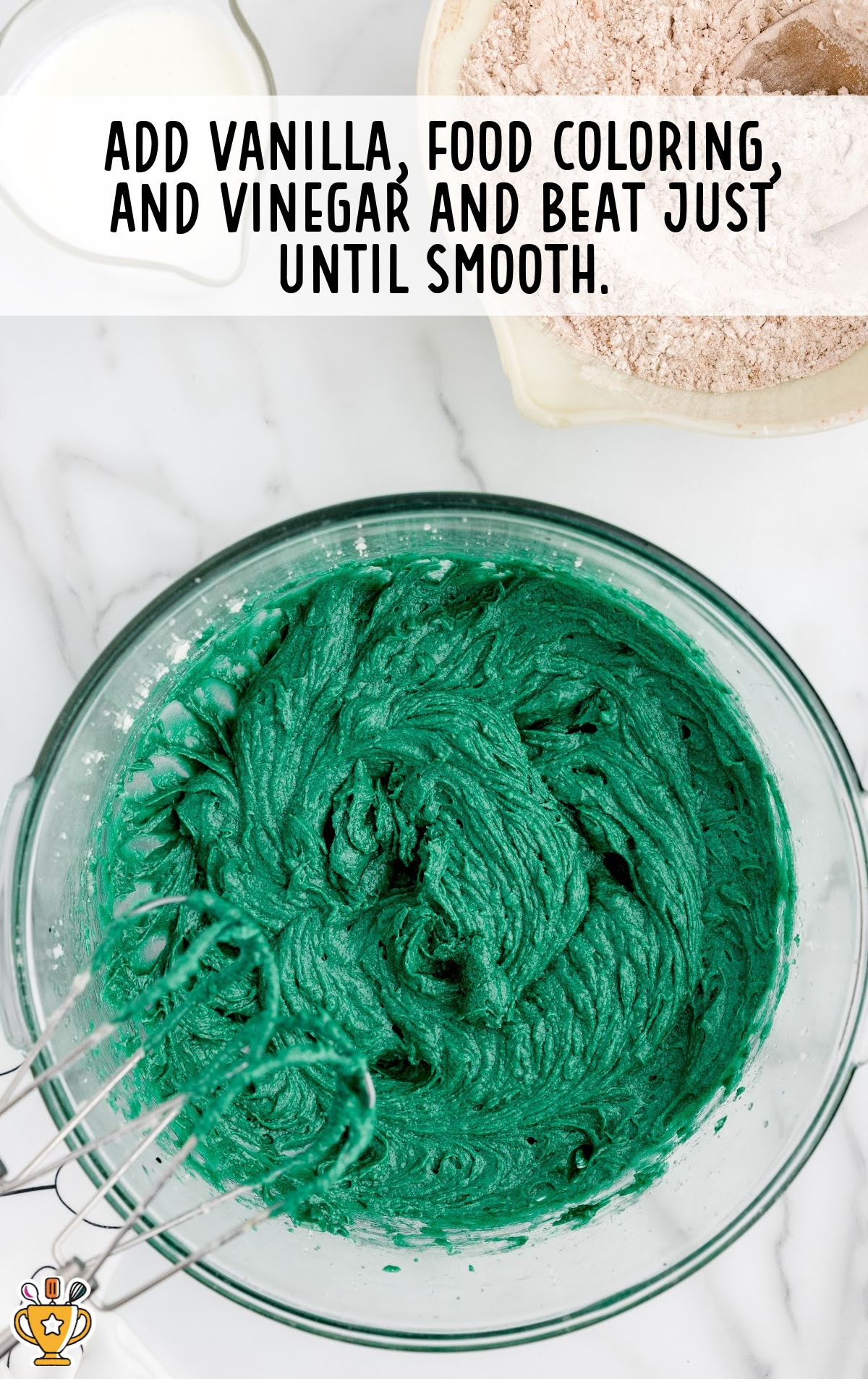 vanilla, food coloring and vinegar added in a bowl