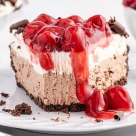 a piece of No Bake Black Forest Cheesecake on a white plate