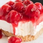 a piece of No Bake Cherry Cheesecake on a plate