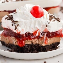 a piece of No Bake Chocolate Cherry Lush on a white plate