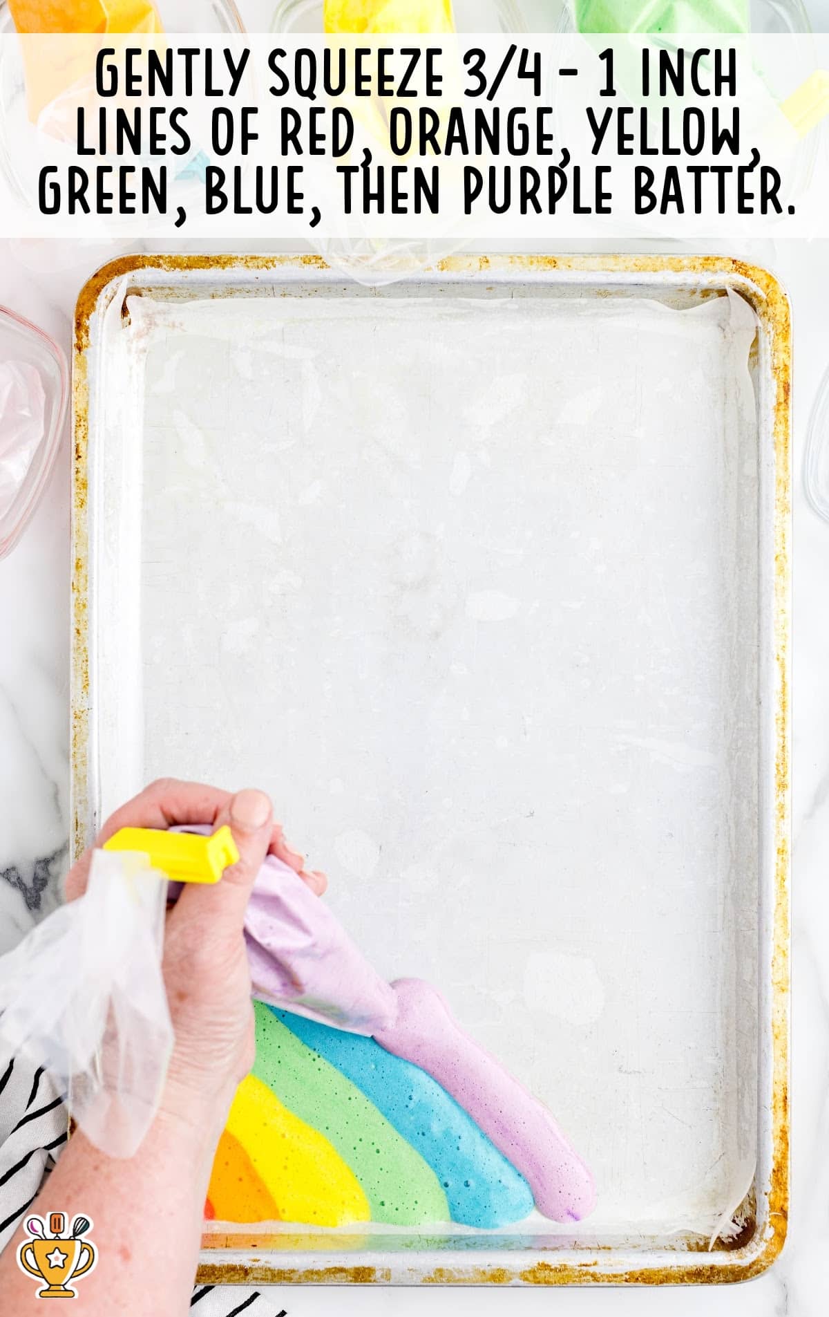 squeezing coloured butter in a baking pan