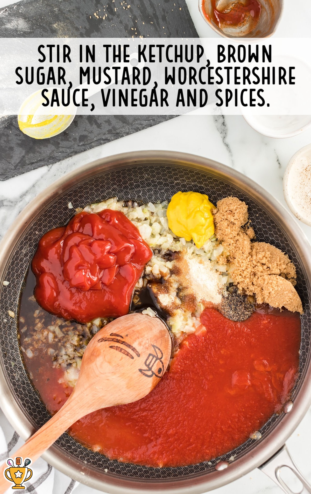 stirring ketchup, brown sugar, mustard, Worcestershire sauce, vinegar and spices mixed in a frying pan