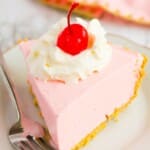 a piece of Strawberry Jello Pie on a plate with a fork