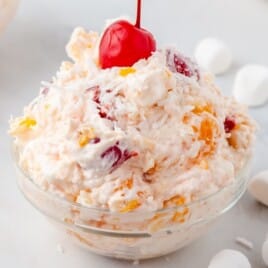 a small clear bowl full of Ambrosia Salad