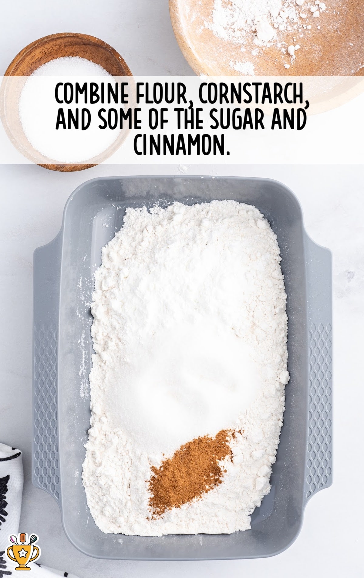 flour, cornstarch, sugar and cinnamon combined together in a conatiner