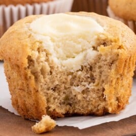 a Banana Cream Cheese Muffin with a bite on it