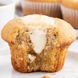 a Banana Cream Cheese Muffin with a bite on it