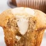 a Banana Cream Cheese Muffin with a bite on it