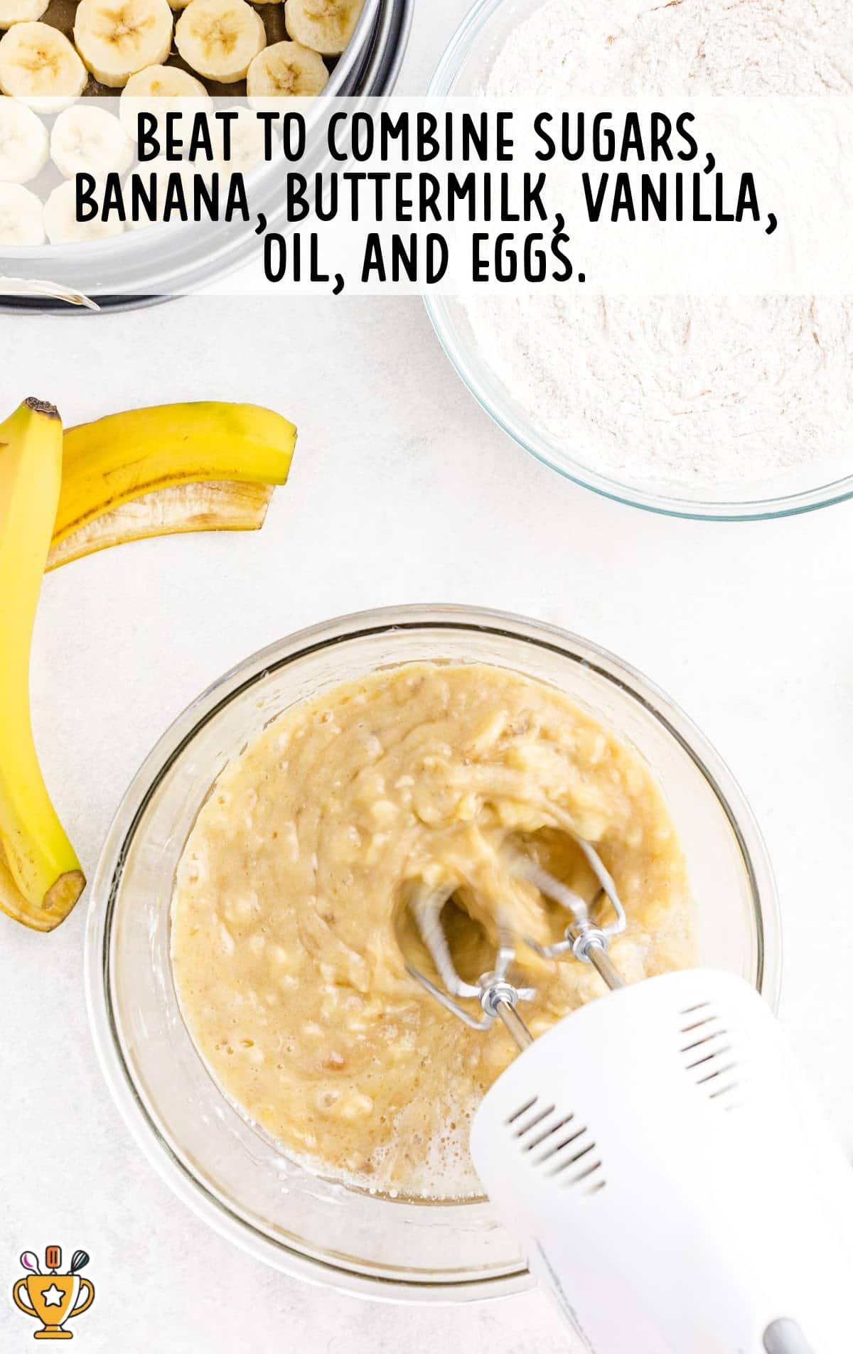 sugars, banana, buttermilk, vanilla, oil and eggs mixed together in a bowl