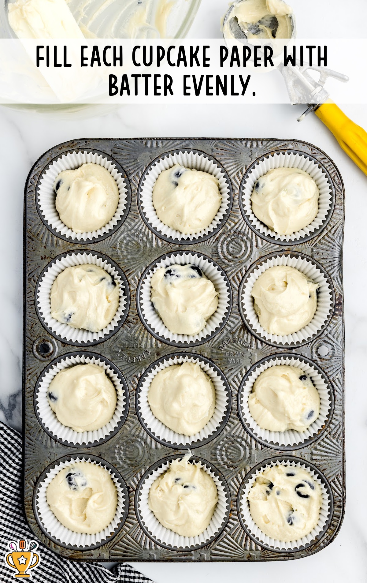 Blueberry Cupcakes batter in a muffin pan