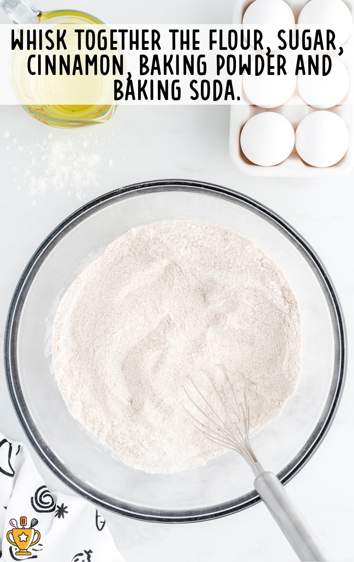 flour, sugar, cinnamon, baking powder and baking soda added in a bowl