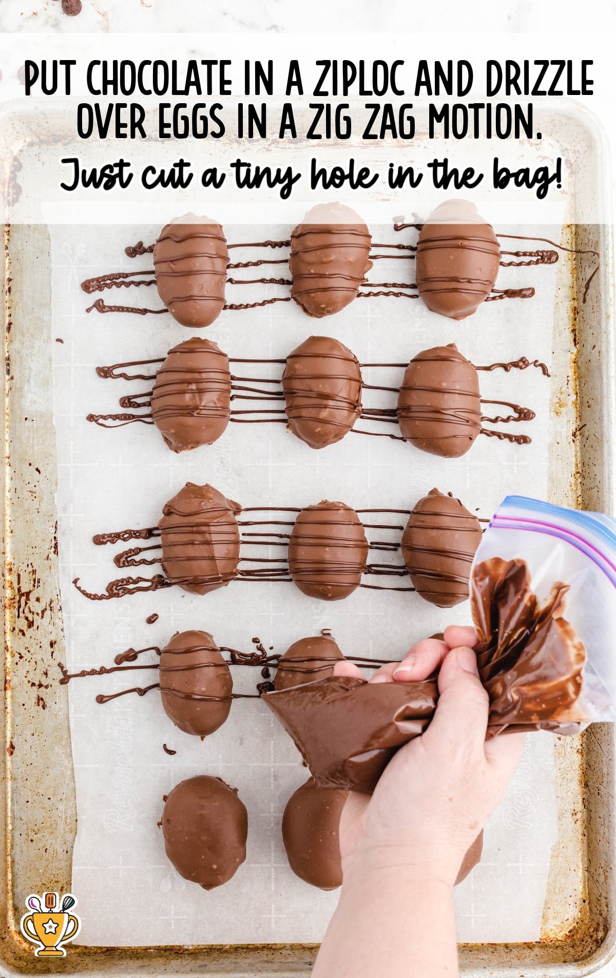 drizzling chocolate over eggs in a zig zag