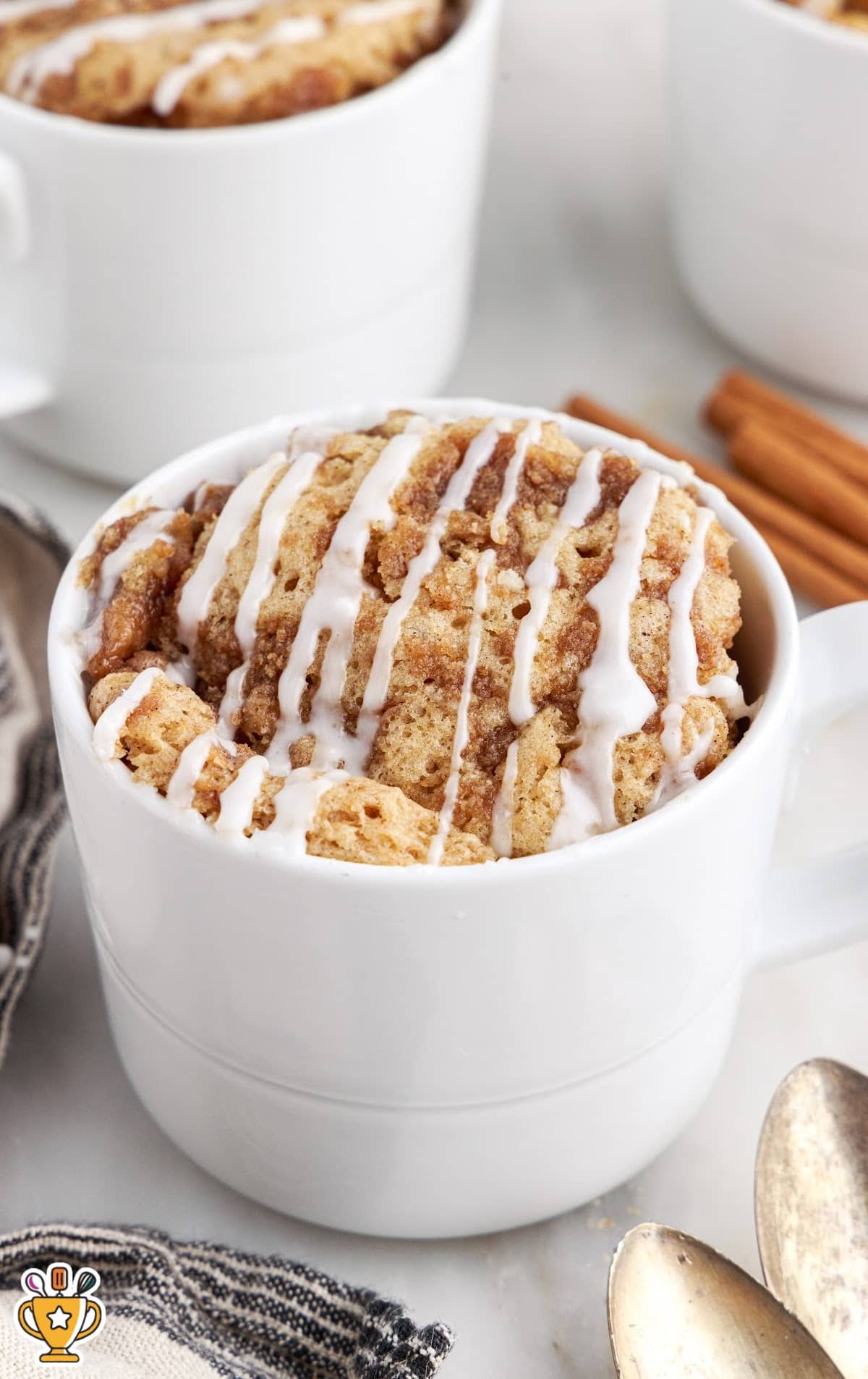 Coffee Cake in a Mug with a drizzle of glaze