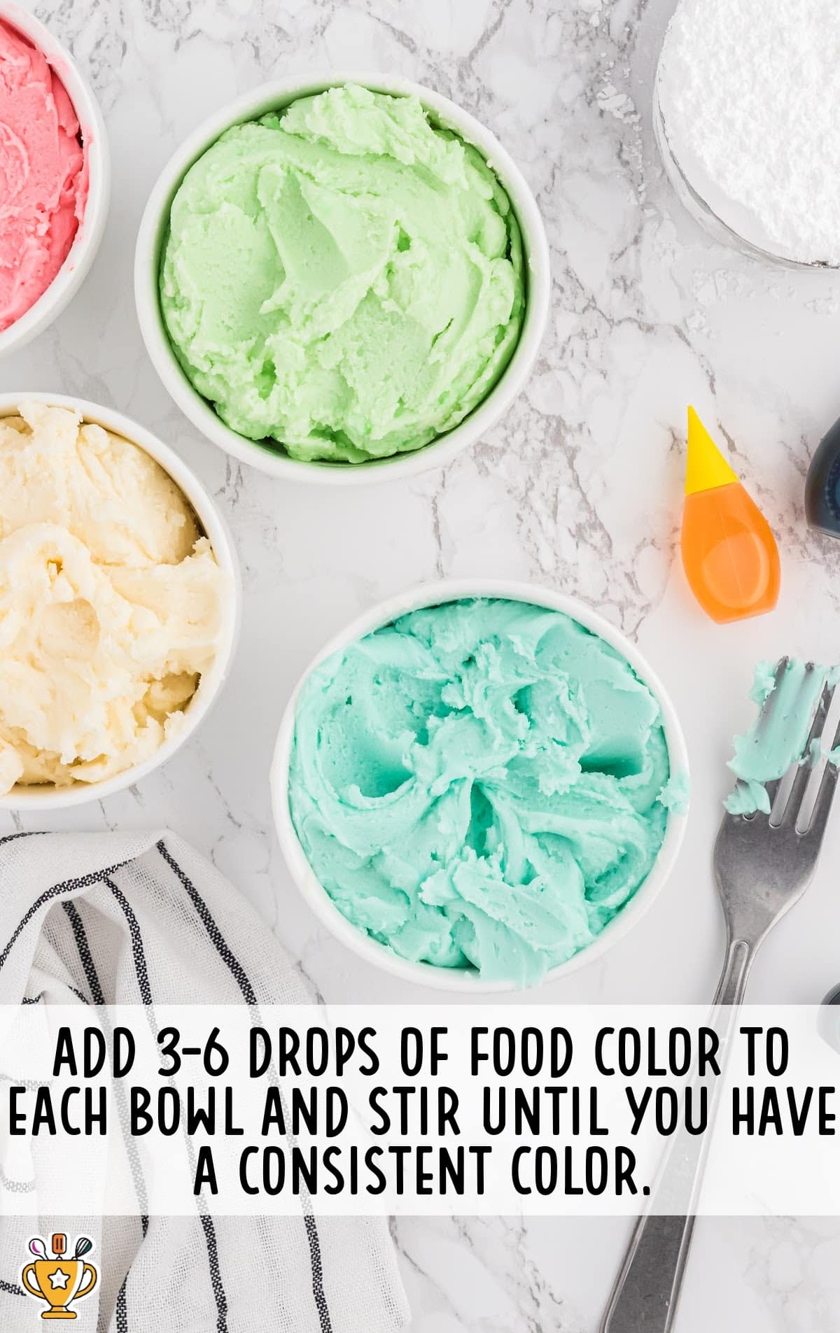 four bowls of Cream Cheese Mints mixture with different colors