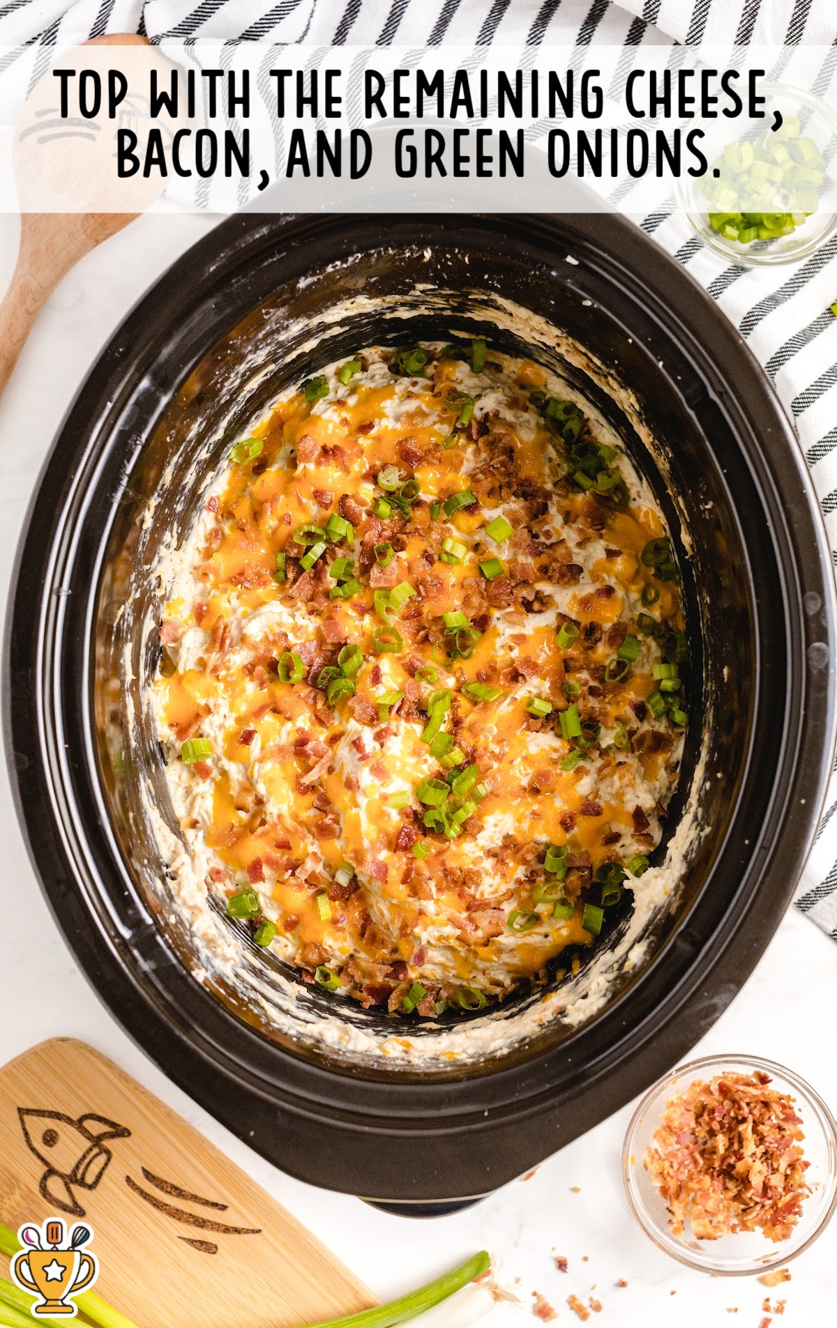 Crockpot Crack Chicken topped with cheese, bacon and green onions