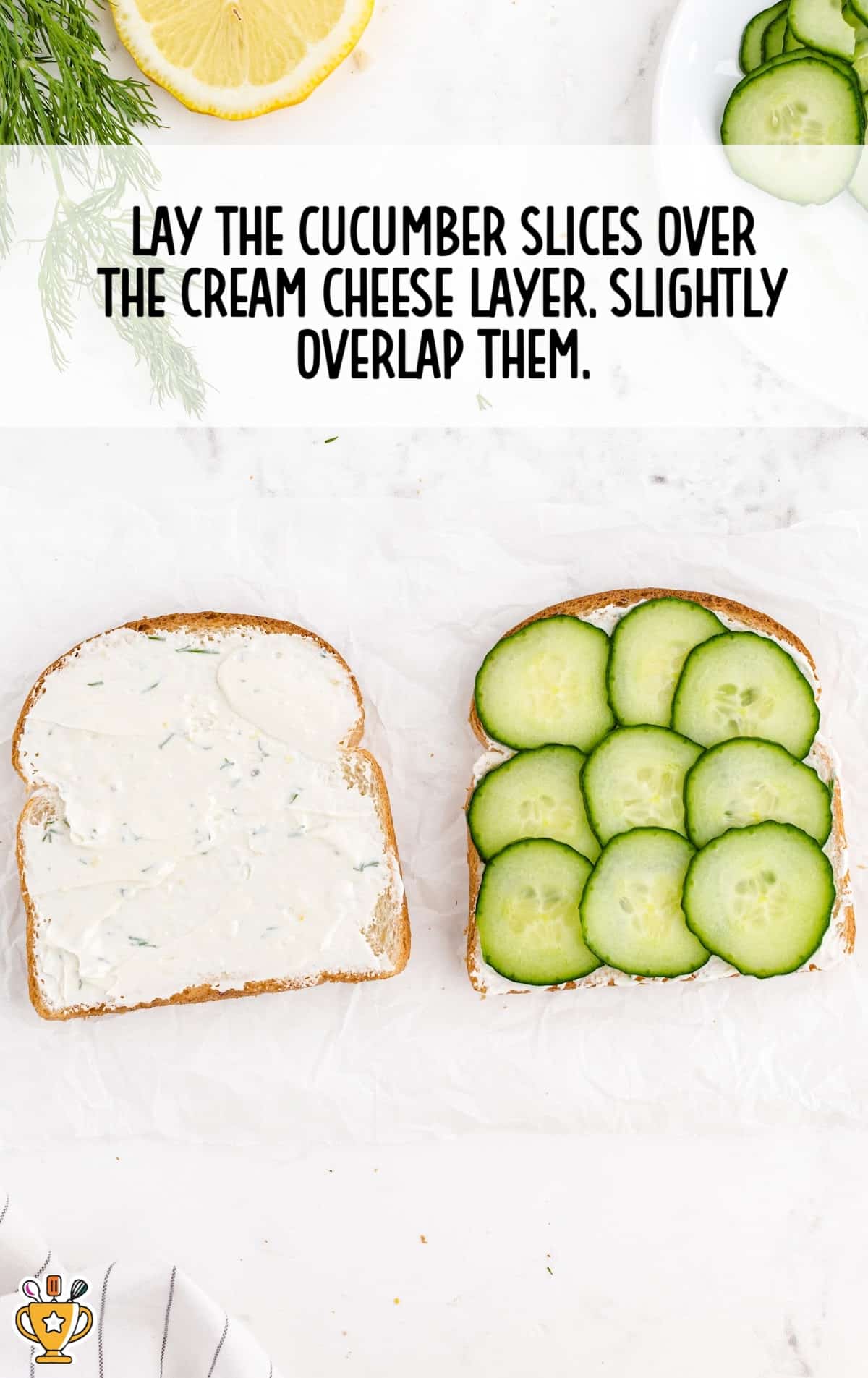 slices of cucumber on top of a slice of sandwich and another slice with cream cheese spread on top